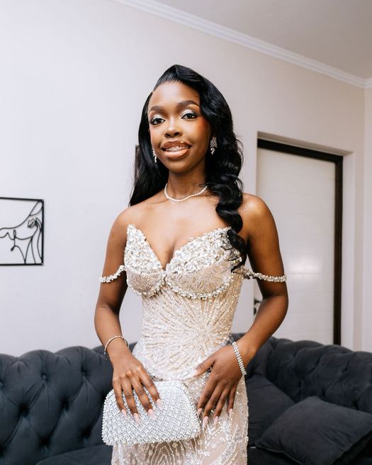 Diamante Silver — Champagne crystal with beaded off-shoulder straps, split to the thigh. Photographed on the stairs.
