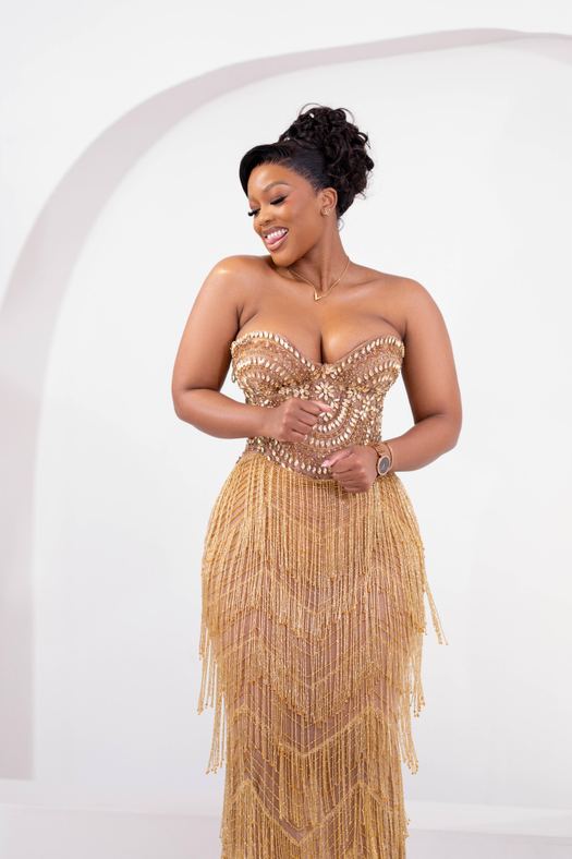 Gold Aquarius — Scalloped gold sequin across a corset, dropping into gold fringe that stops at the ankle.